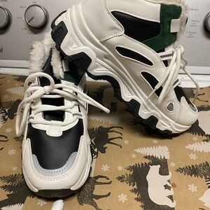 Stylish Black and White Ankle Boots with Green Accents